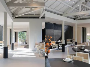 Modern interior design of a restaurant dining room with contemporary furniture and minimalist decor.
