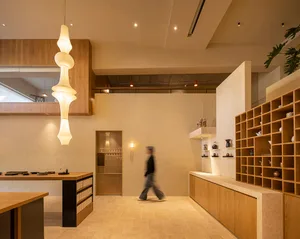 A minimalist coffee shop with wooden furniture and decor.