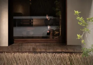 A traditional Japanese living room with wooden floors and a bamboo fence.