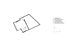 Office space with industrial design features, primarily concrete material.