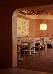 Clay tiles, white marble and wooden elements in the interior of a restaurant