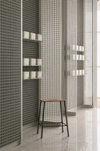 Modern retail storefront with grid metal and tile walls