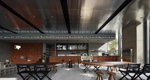 Modern coffee shop interior with brick walls, concrete floors, and stainless-steel accents.