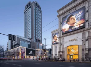 Modern high-rise buildings with large billboard advertisements.