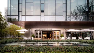 Modern coffee shop facade with glass curtain wall and outdoor seating area
