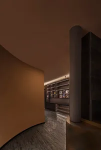 A modern lobby with a concrete floor and wall.
