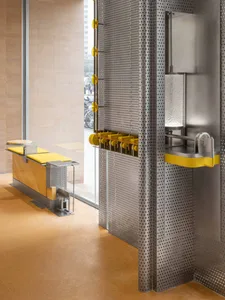Industrial-style interior with metallic walls and yellow accents