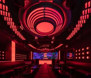 Industrial nightclub with neon lighting and red and black color scheme