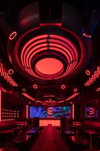 Interior design of a modern nightclub with neon lighting.