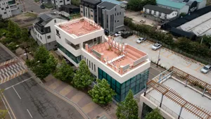 Modern office building with a glass rooftop