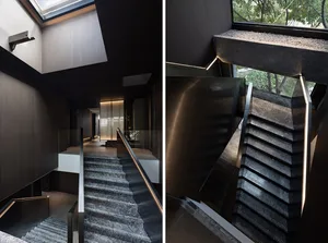 Modern interior staircase made of black marble and metal
