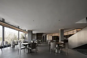 Modern restaurant interior with concrete and metal materials