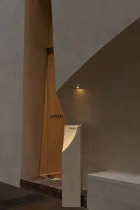 Modern hotel entry with wooden frame and stone and brick wall