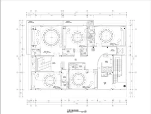 Floor plan of a restaurant layout with multiple dining areas and restrooms.