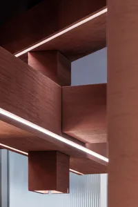 A modern interior design featuring wooden floating shelves with integrated lighting.