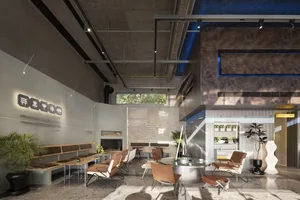 Modern restaurant featuring concrete, wood, metal, and glass materials