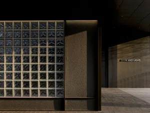 Contemporary interior design featuring glass block walls and contrasting lighting elements.