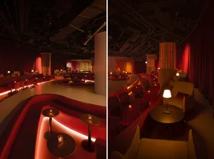 A modern bar lounge featuring red lighting, upholstered seating, and sleek furniture.