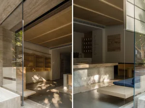 Interior of a modern coffee shop featuring concrete and wooden elements.