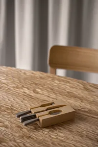 Handcrafted wooden flatware block with sleek, silver utensils