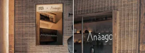 Restaurant interior with wooden textures and a glass door.
