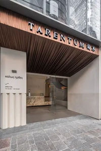 Modern storefront interior with a glass entrance and contemporary materials.