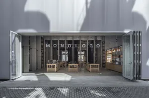 Modern coffee shop with concrete and stone interior design