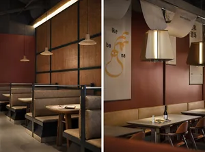 Indoor Japanese restaurant with wooden walls, leather booths, and metal tables.