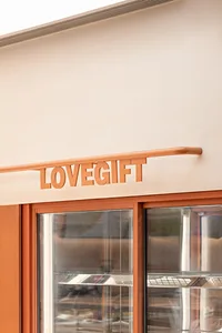 Storefront with glass panels and signage