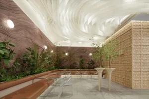 Modern restaurant interior with wooden walls, concrete flooring, and greenery