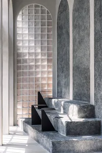 Modern coffee shop interior with granite and concrete materials