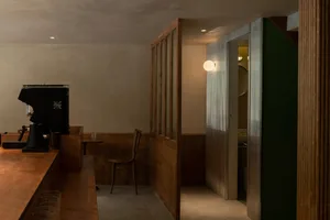 Industrial-style restaurant bar with metal walls and decor.