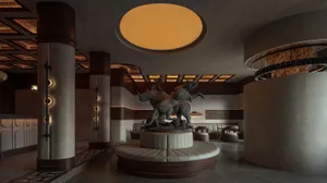 A modern hotel lobby with concrete columns, a circular light fixture, and a statue of a lion and a rhinoceros.