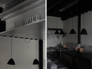 Industrial-style bar counter with metal material, industrial lighting, and minimalist design.