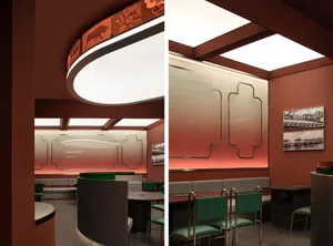 Modem restaurant interior with green seating arrangements and a mix of materials.
