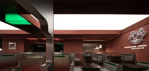 Modern restaurant interior with red brick and concrete materials