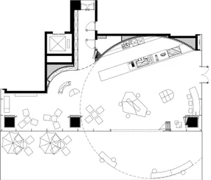 Black and white drawing of an office space layout with desks, chairs, and other furniture.
