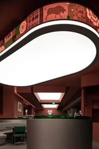 A modern restaurant interior with metal and concrete materials and minimalist design.