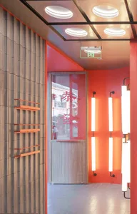 An orange and wood interior design of a modern restaurant.