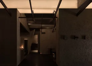 A modern cafe interior with concrete walls and a minimalist design.