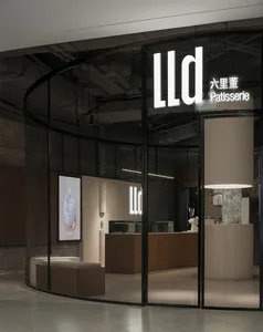 LLD Patisserie storefront with glass windows and signage