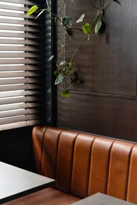 Modern, contemporary leather booth seating in a restaurant interior design setting.