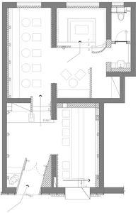A detailed architectural floor plan of an industrial office space, showing interior design elements and layout.