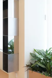 Modern art modernism metal planter featuring a sleek, minimalist design with green foliage.