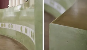 Concrete architectural column with circular patterns and smooth surface