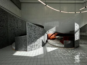 Modern interior design space featuring concrete walls and mosaic tile seating