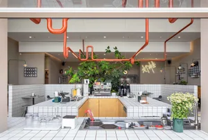 Industrial design cafe interior featuring a tiled and concrete floor