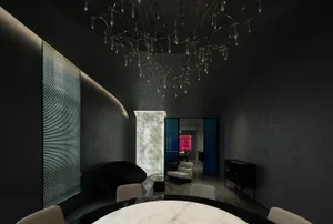 Modern residential dining room with marble table, metal chandelier, and dark-colored walls.