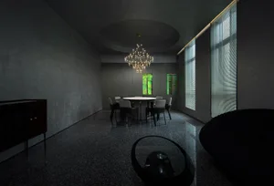 Modern dining room featuring glass elements and contemporary design.