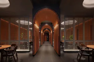 Industrial-style restaurant interior with wooden walls and archways